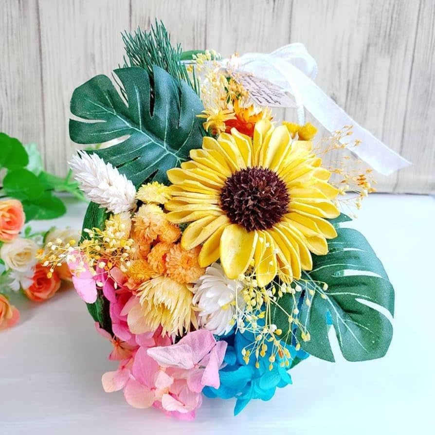 アメリカンフラワーのひまわりのアレンジ、モンステラ、ユッカ 本物