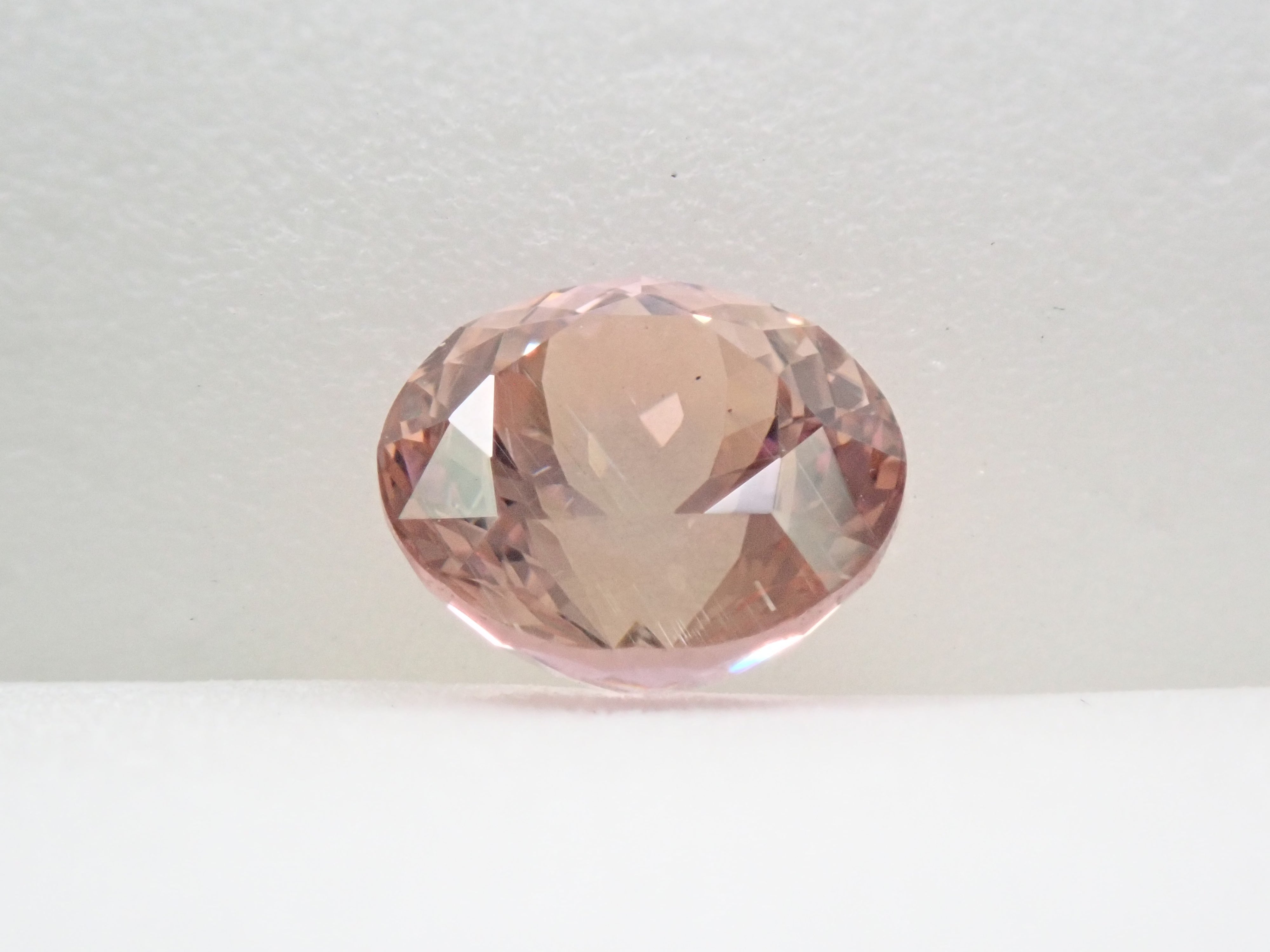 タンザニア産ピンクゾイサイト 6.6mm/1.393ctルース（ピーチタンザナイト）