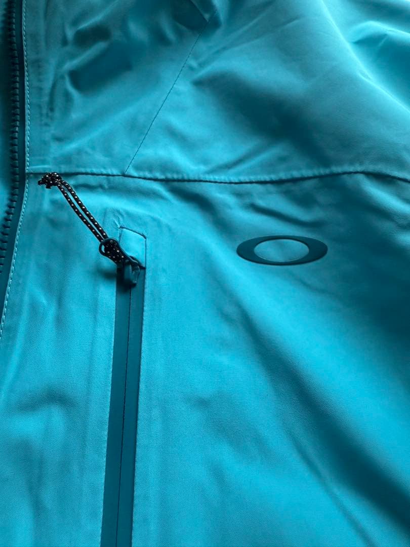Oakley 防水ジャケット 水色