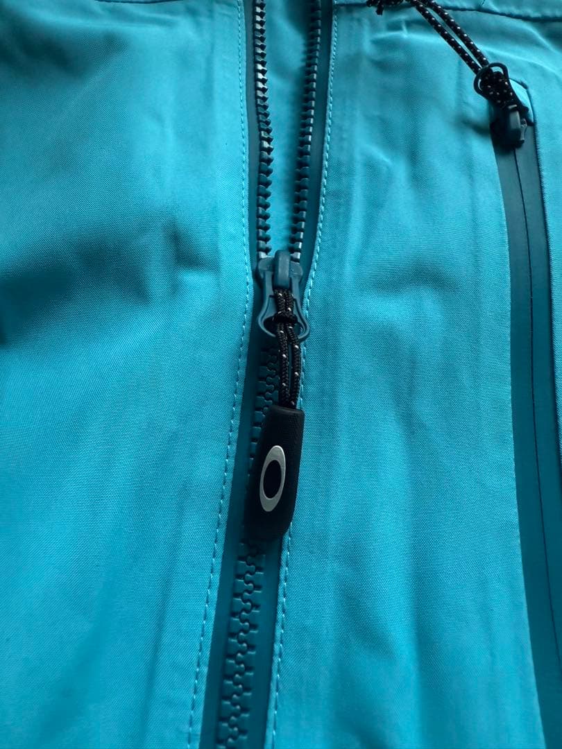 Oakley 防水ジャケット 水色
