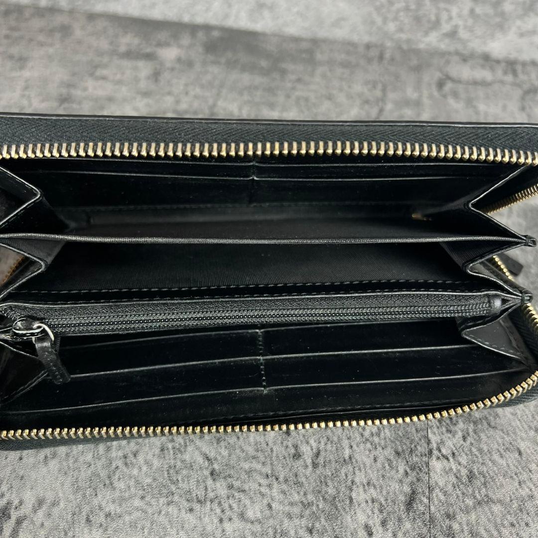 GUCCI GGエンボス インターロッキング リボン金具 ラウンド 長財布