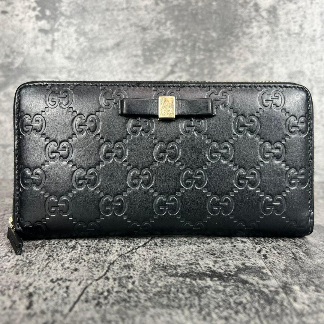 GUCCI GGエンボス インターロッキング リボン金具 ラウンド 長財布