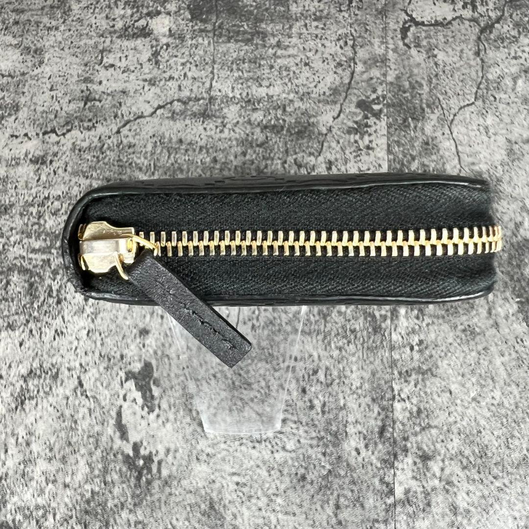 GUCCI GGエンボス インターロッキング リボン金具 ラウンド 長財布