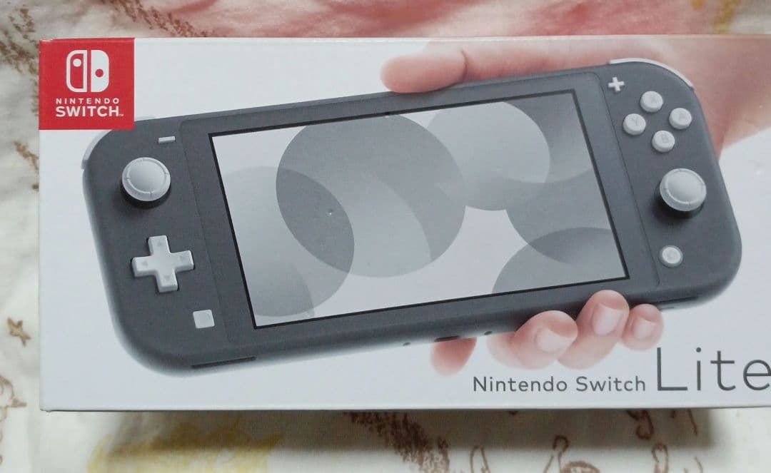 新品•未開封任天堂switchライト本体•ソフト2本シュリンク付き