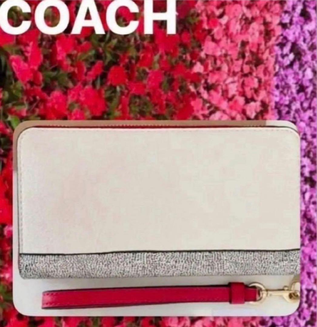 COACHストラップ付長財布ディズニーキースヘリング.コラボ.UFOプリント新品
