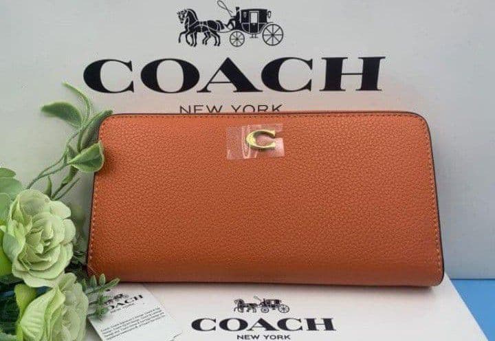 新品未使用コーチ長財布オレンジロングジップレディースメンズ送料無料即日発送