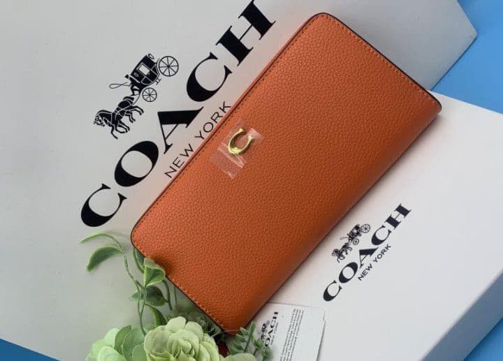 新品未使用コーチ長財布オレンジロングジップレディースメンズ送料無料即日発送