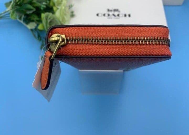 新品未使用コーチ長財布オレンジロングジップレディースメンズ送料無料即日発送