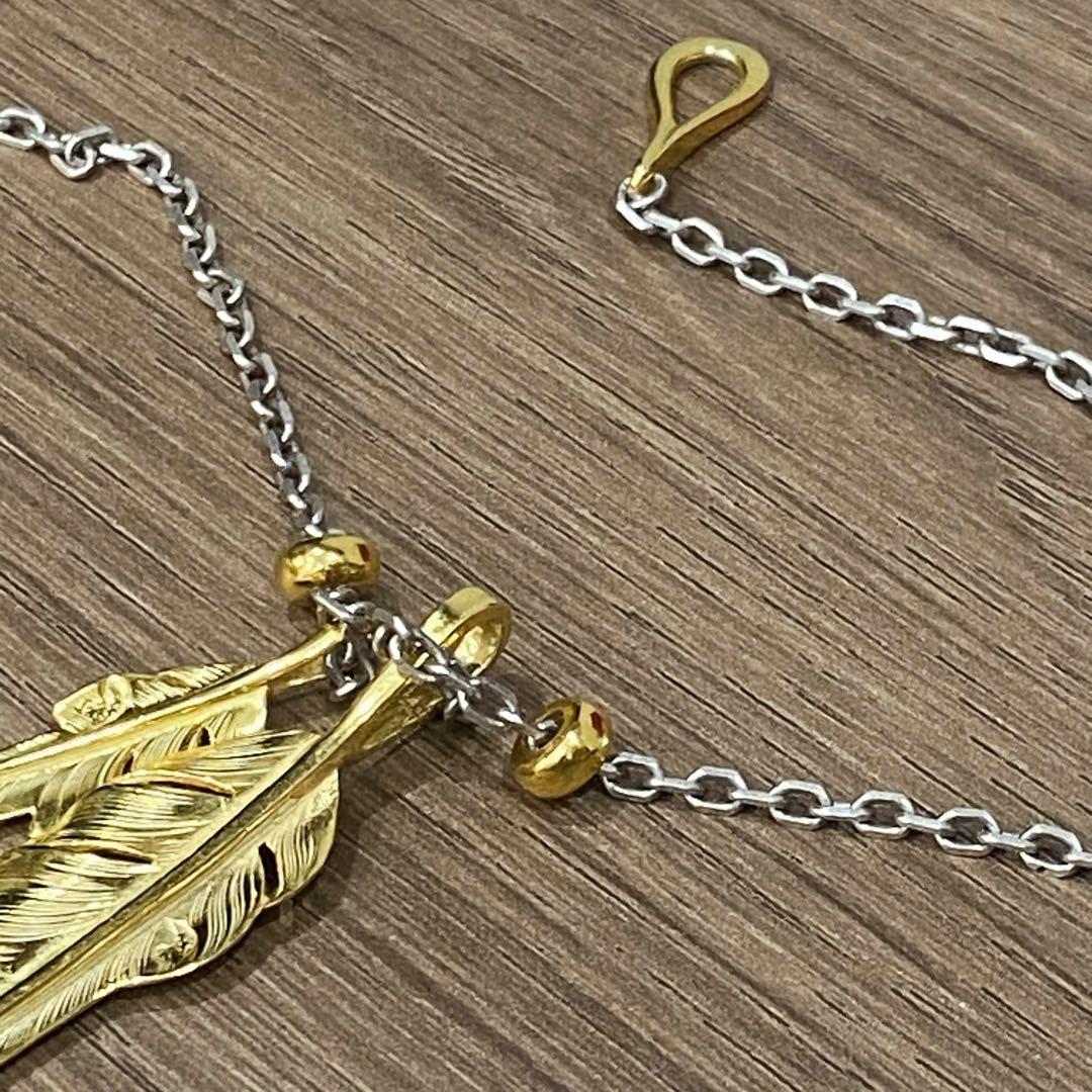 UNOAERRE ツイストデザイン バングルk9