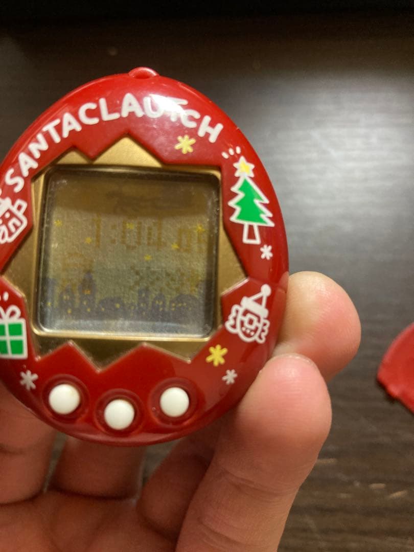 【動作確認済・ジャンク】サンタクロっちのたまごっち　レッド　※裏蓋両側ビス欠け