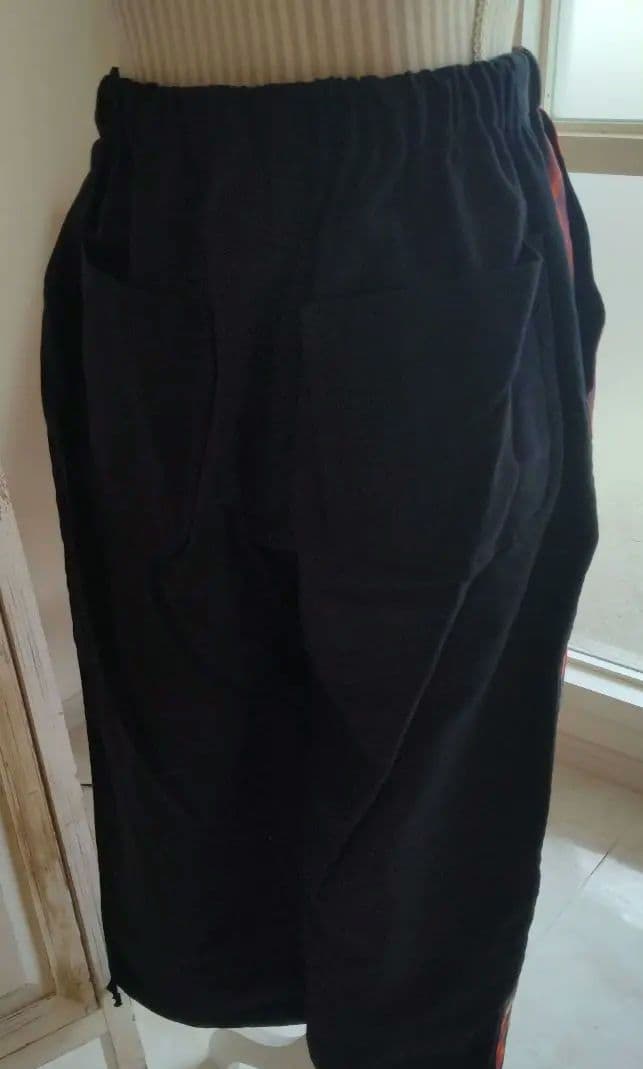 COMME des GARÇONS 黒とオレンジの花柄 ガウチョパンツ