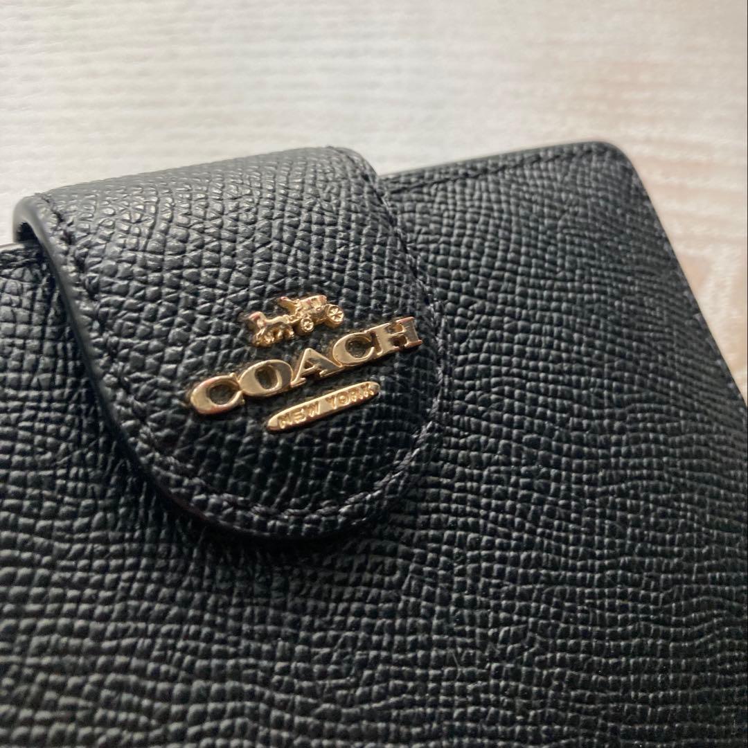 COACH コーチ　2つ折財布黒　ゴールド金具馬車ロゴ