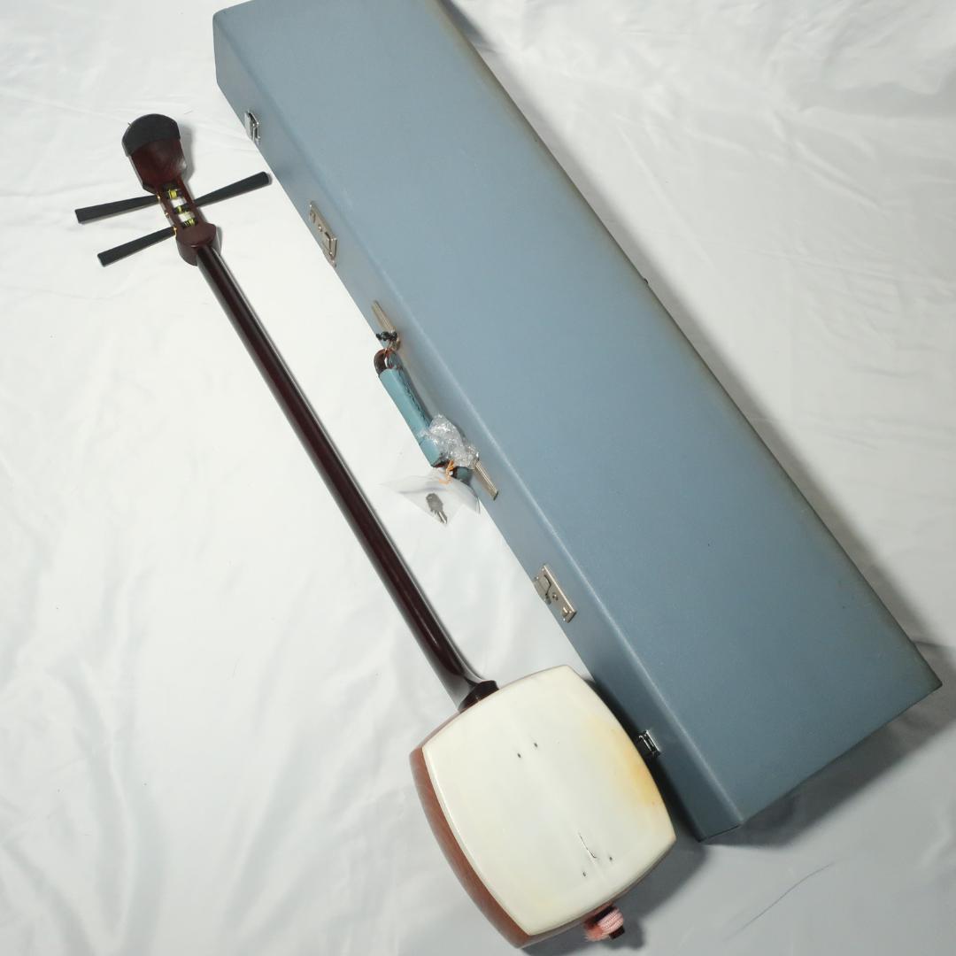 三味線 金細 子持ち綾杉胴 トチ紅木 黒檀糸巻き 撥 ハードケース付属