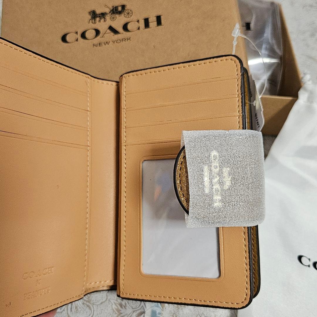 COACH スヌーピー柄 二つ折り財布 新品未使用 保存袋、箱付 - メルカリ