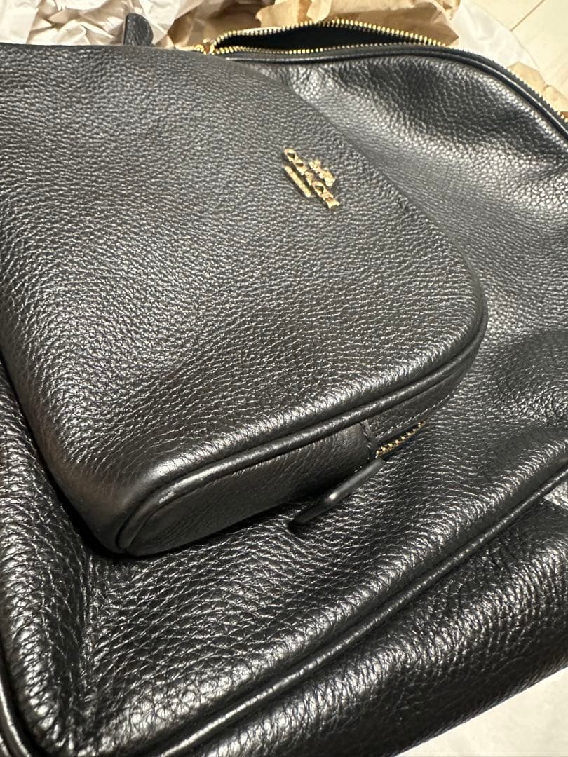 バッグ COACH PEBBLED LEATHER COURT BACKPACK