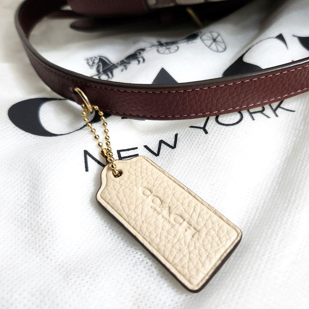 新品未使用　コーチ　デンプシー　本革　リュック　シグネチャー　ワインレッド